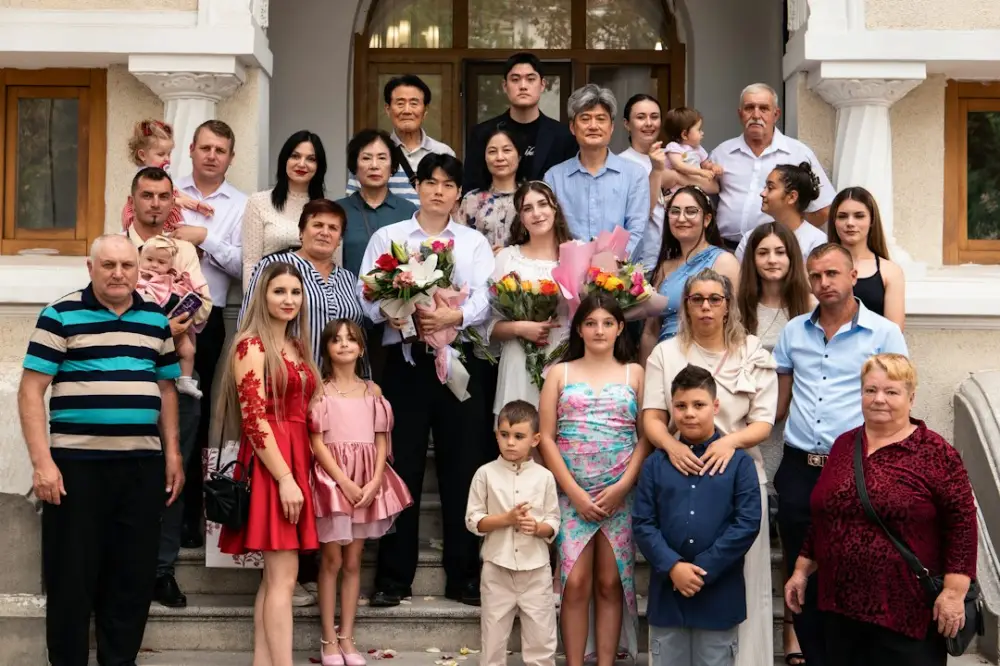 A large family posing for a group portrait on stone steps outside a building, illustrating fiscal sustainability
